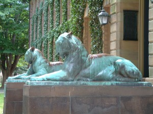 Bronze tiger sculptures by Alexander Phimister Proctor (1862-1950), dedicated 1909, in front of Nassau Hall doors; Princeton University; Princeton, New Jersey